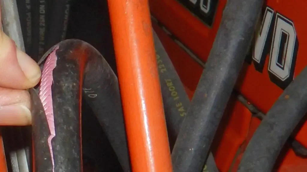 how to disconnect hydraulic hose from tractor