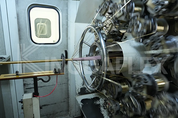 Hydraulic hose reinforcement layer weaving machine